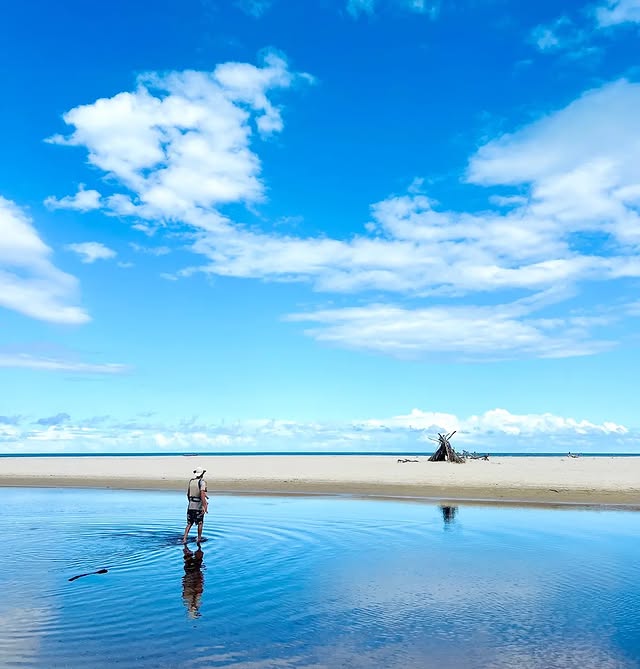 From the pool's edge, the sky runs to the sea